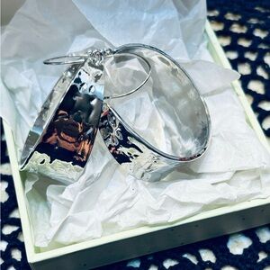 NWOT silver hoop earrings. Never been worn.